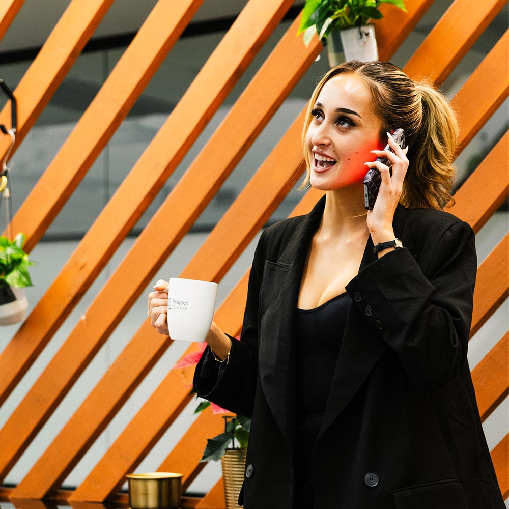 Project Cowork client taking a business phone call