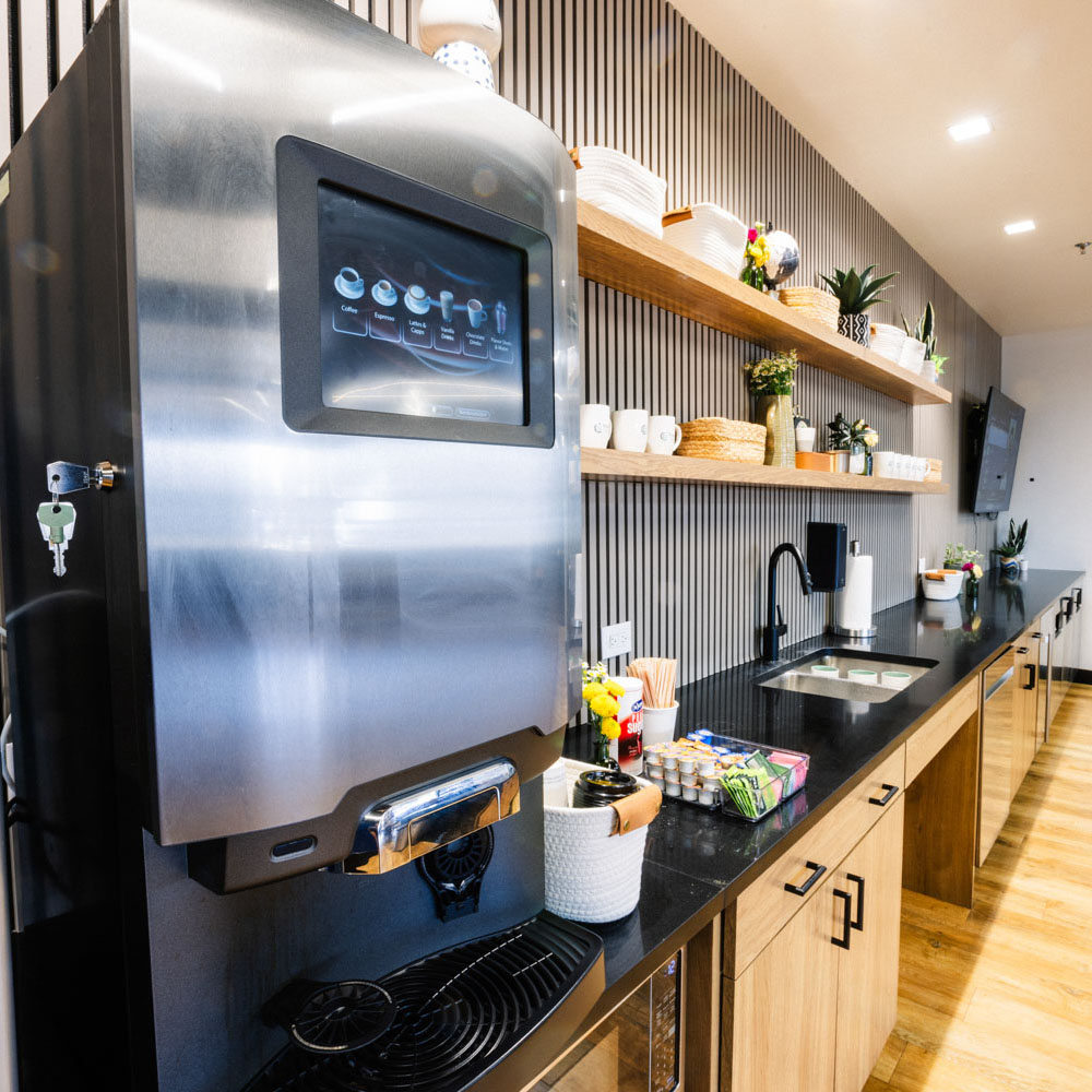 Project Cowork kitchen area with large coffee machine