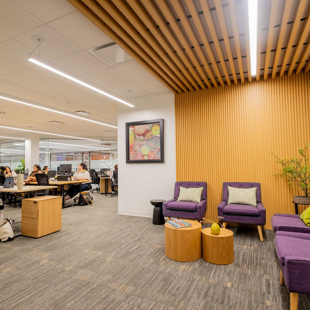 project cowork communal office space with common area for sitting and reading