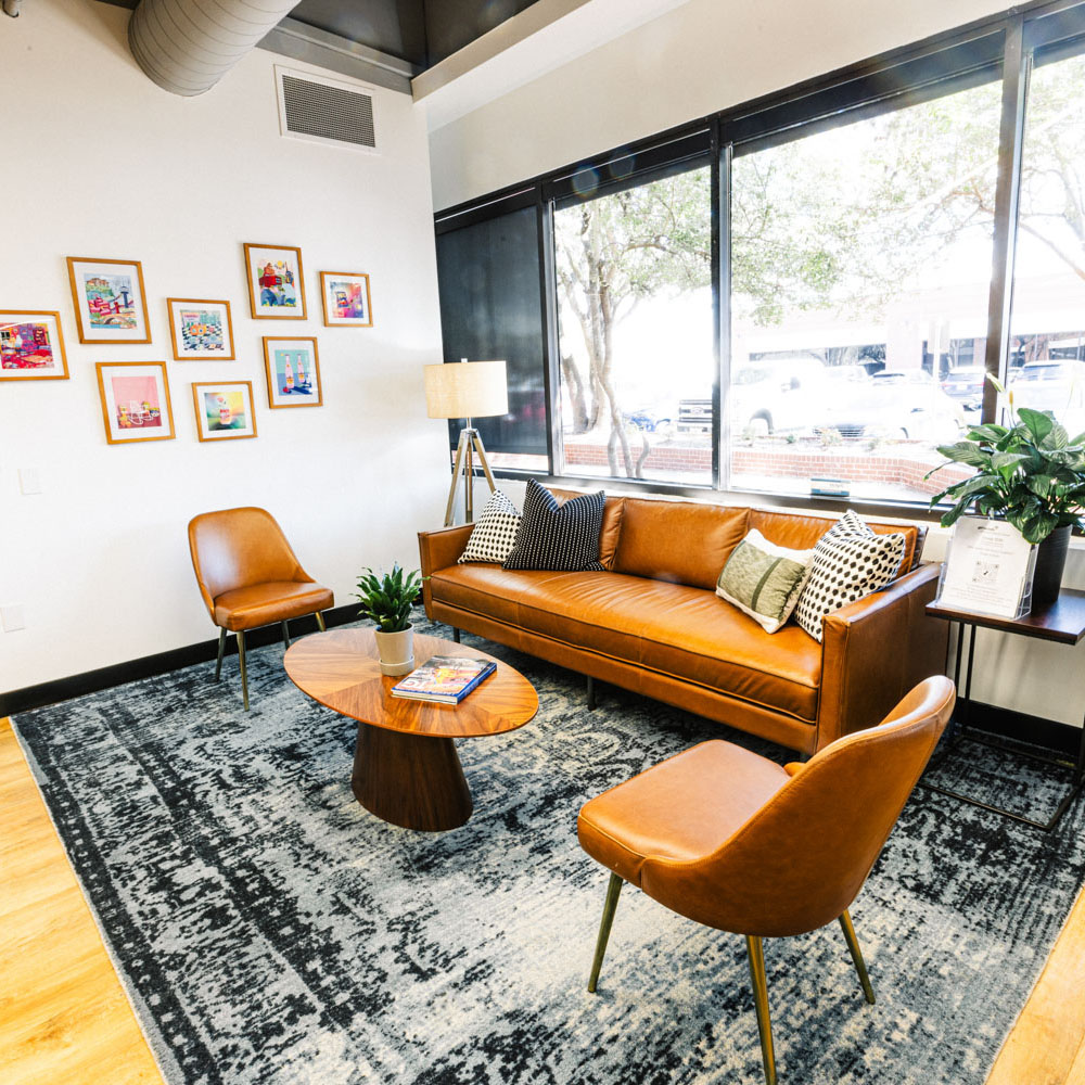 Project Cowork seating area with 2 chairs, coffee table and sofa