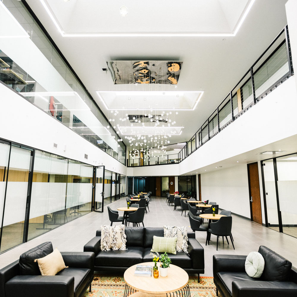 Project cowork common area. Lots of cafe seating and couches for resting and taking breaks
