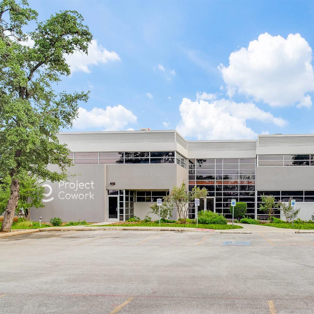 Project Cowork Northwest exterior. There is a blue sky in the background and trees/foliage in the foreground